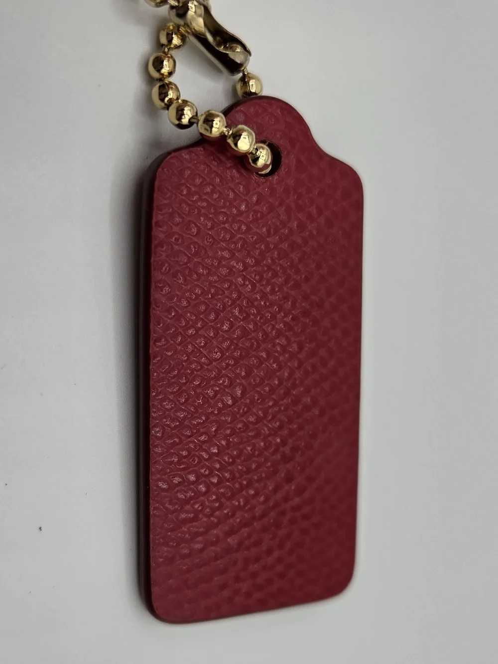 Coach Pink-Red Textured Leather Key Tag with Gold Ball Chain